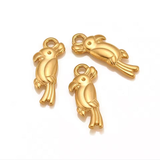 Three gold plated stainless steel parrot-shaped charms for bracelets and pendant necklaces in Mauritius and France.