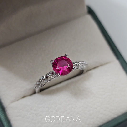 Silver jewelry ring with a vibrant red gemstone, stainless steel band, elegant fashion jewelry for unisex style, Mauritius.