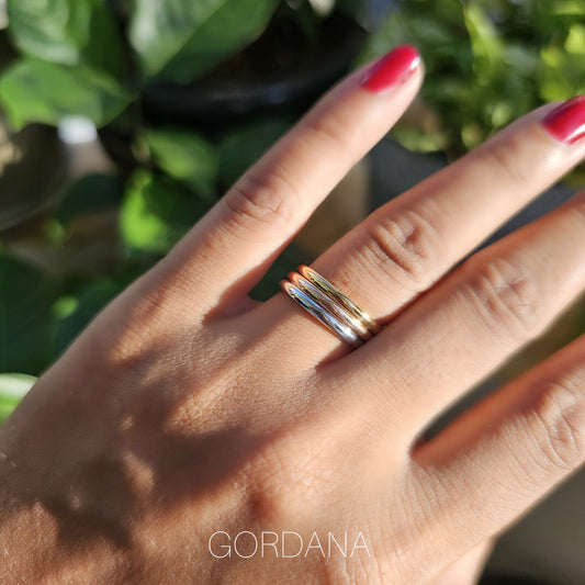 Dainty trio set of stainless steel 18K gold plated rings with silver and gemstone accents, unisex fashion jewelry inspired.