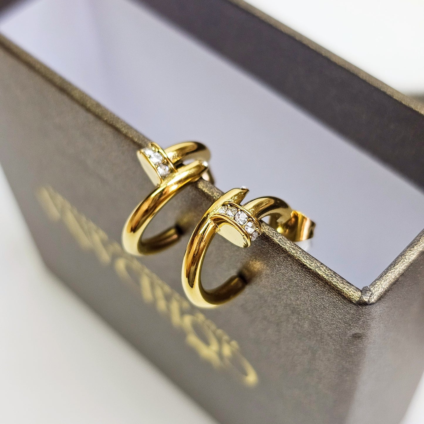 Nail stainless steel semi hoop earrings