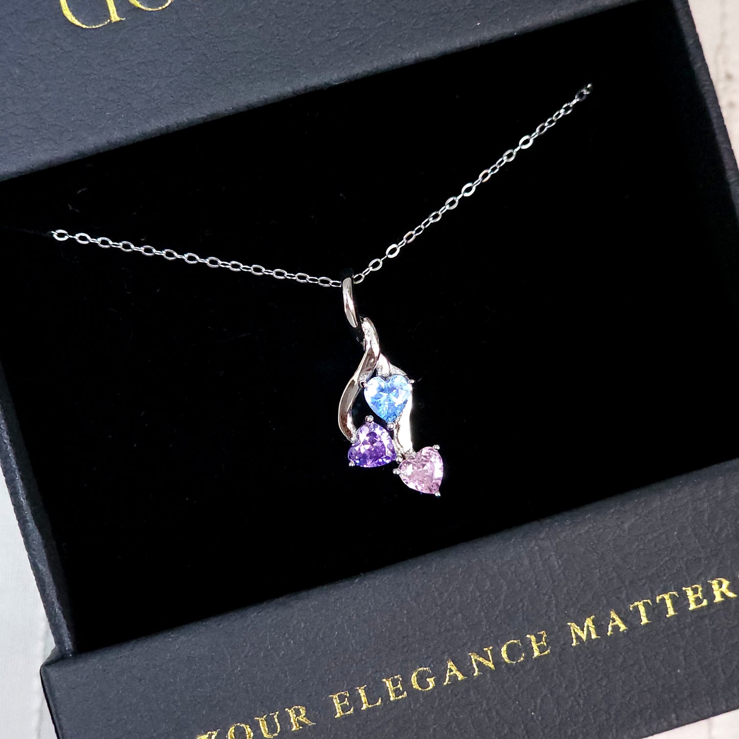 Sterling Silver Triple Heart Pendant Necklace – Blue, Purple & Pink Gemstones