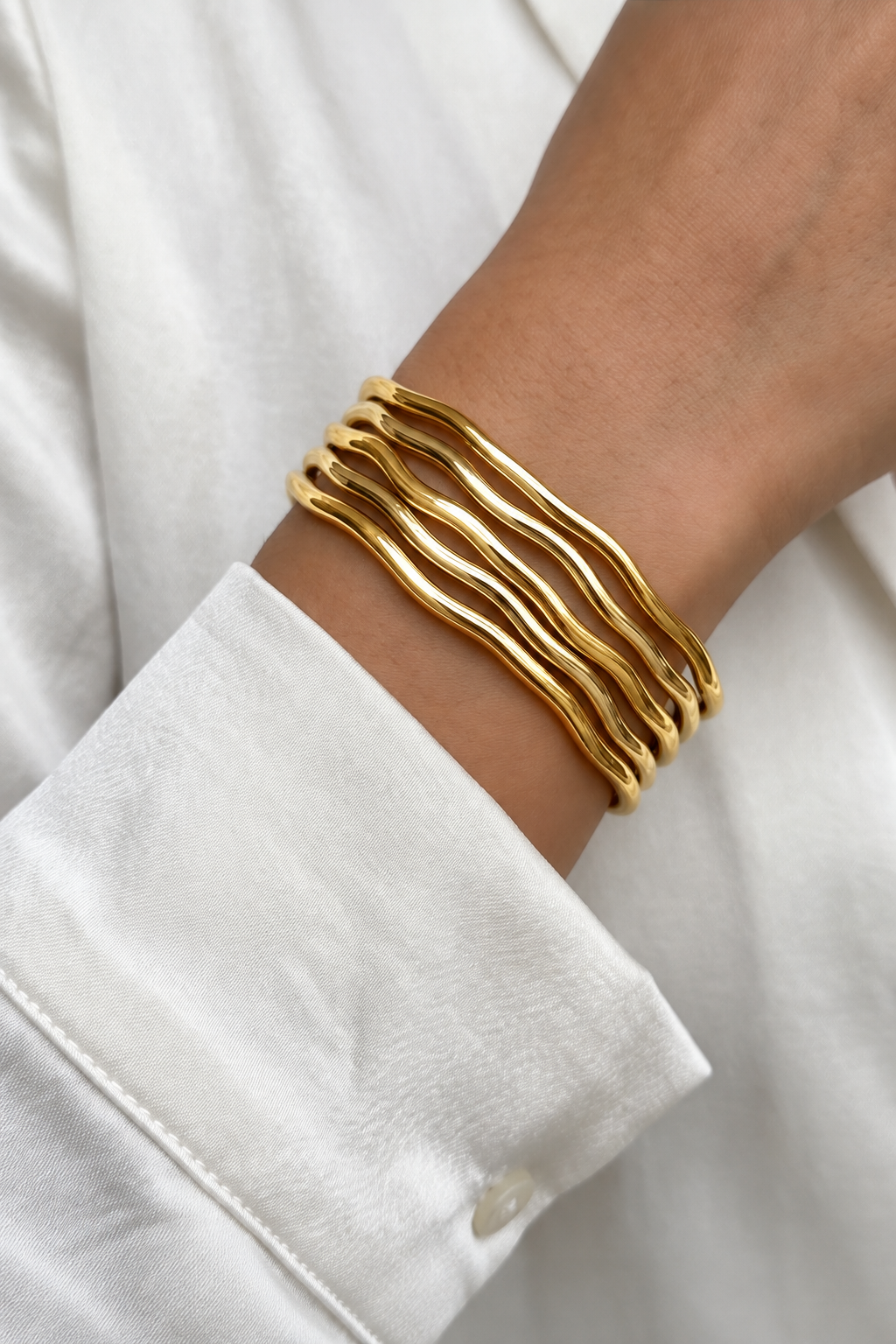 Sculpted Wave Stainless Steel Bangle – Gold & Silver