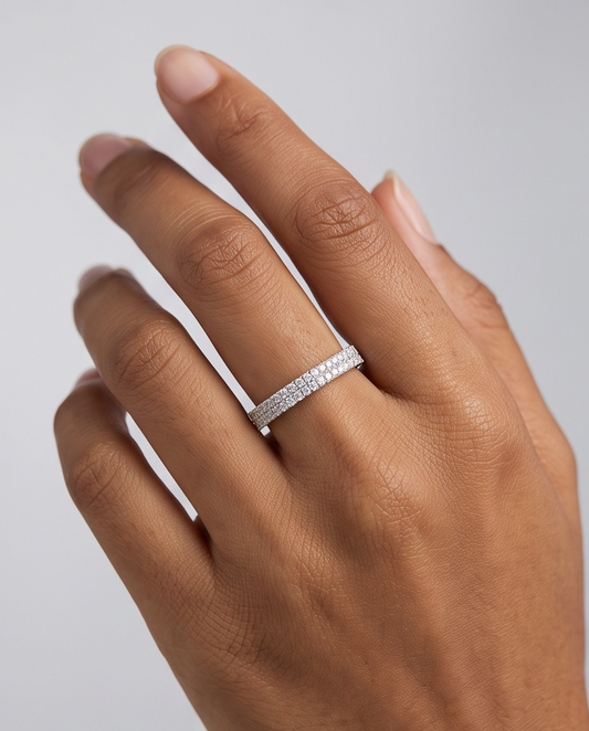 A close up picture of a luxurious S925 Sterling silver band ring on a woman's hand.