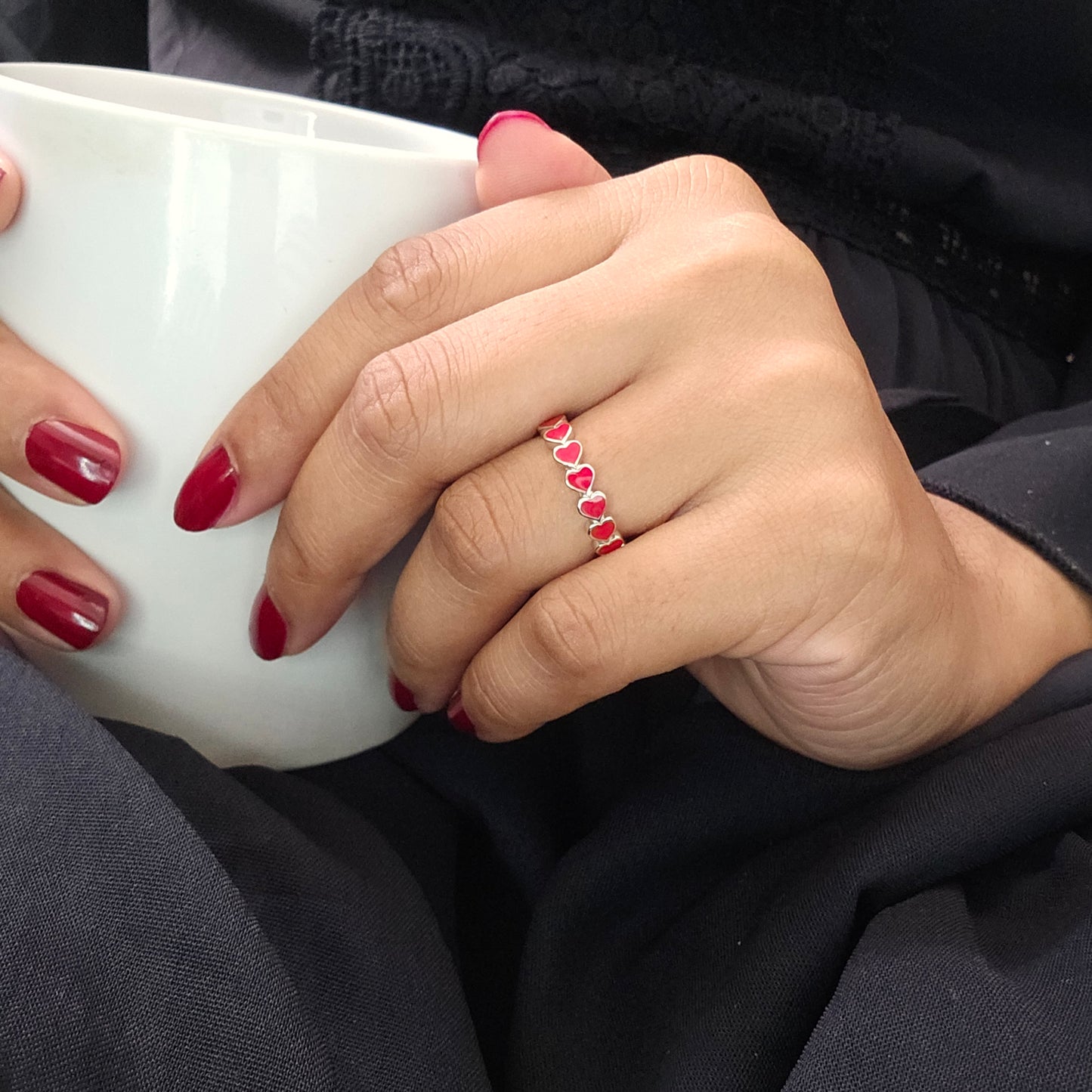 Silver jewelry ring with seven oval red gemstones, stainless steel, unisex fashion jewelry style.