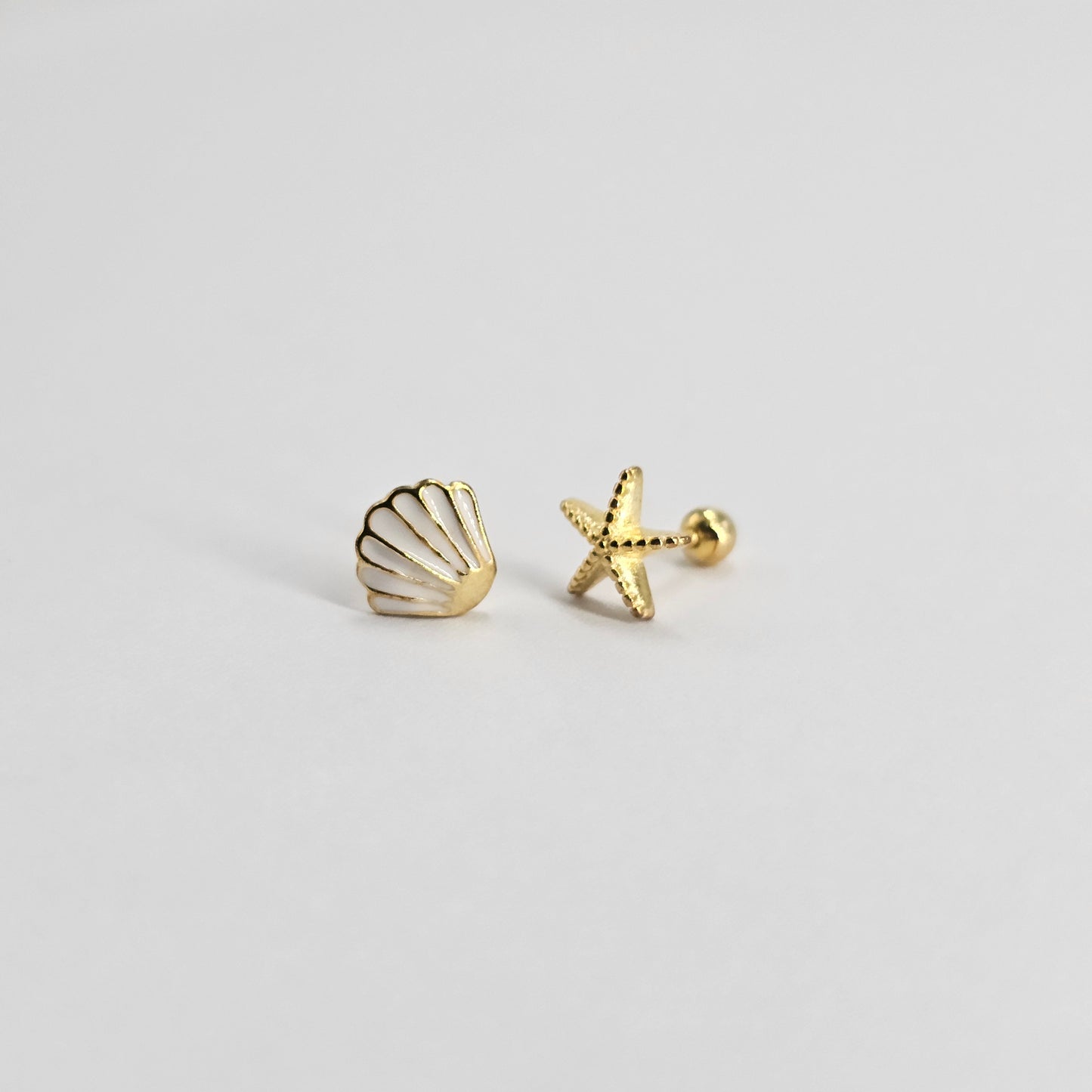 Gold stainless steel shell and starfish earrings with elegant, fashionable design for kids.