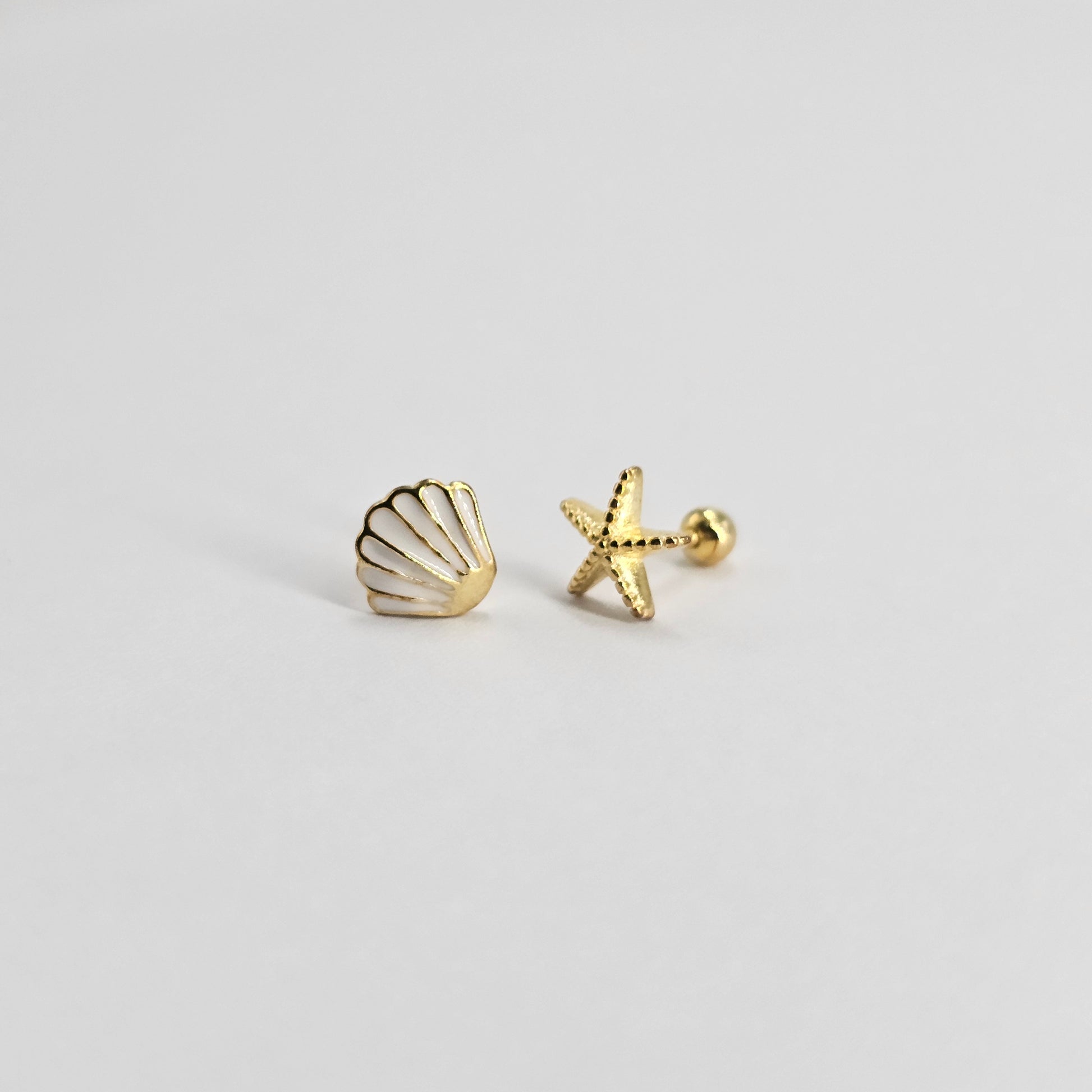 Gold stainless steel shell and starfish earrings with elegant, fashionable design for kids.