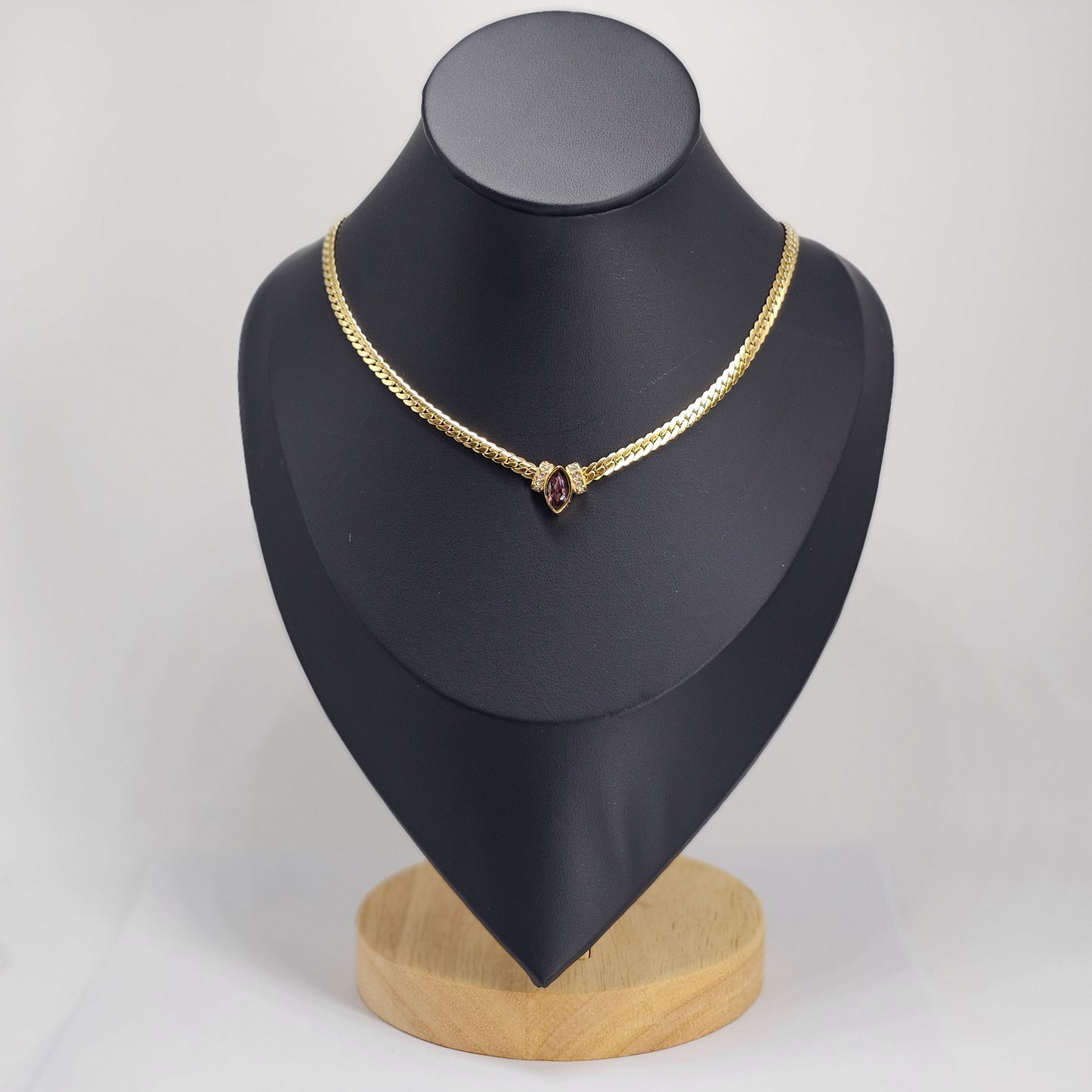 Elegant 18k gold plated stainless steel necklace with a central red gemstone, unisex fashion jewelry.