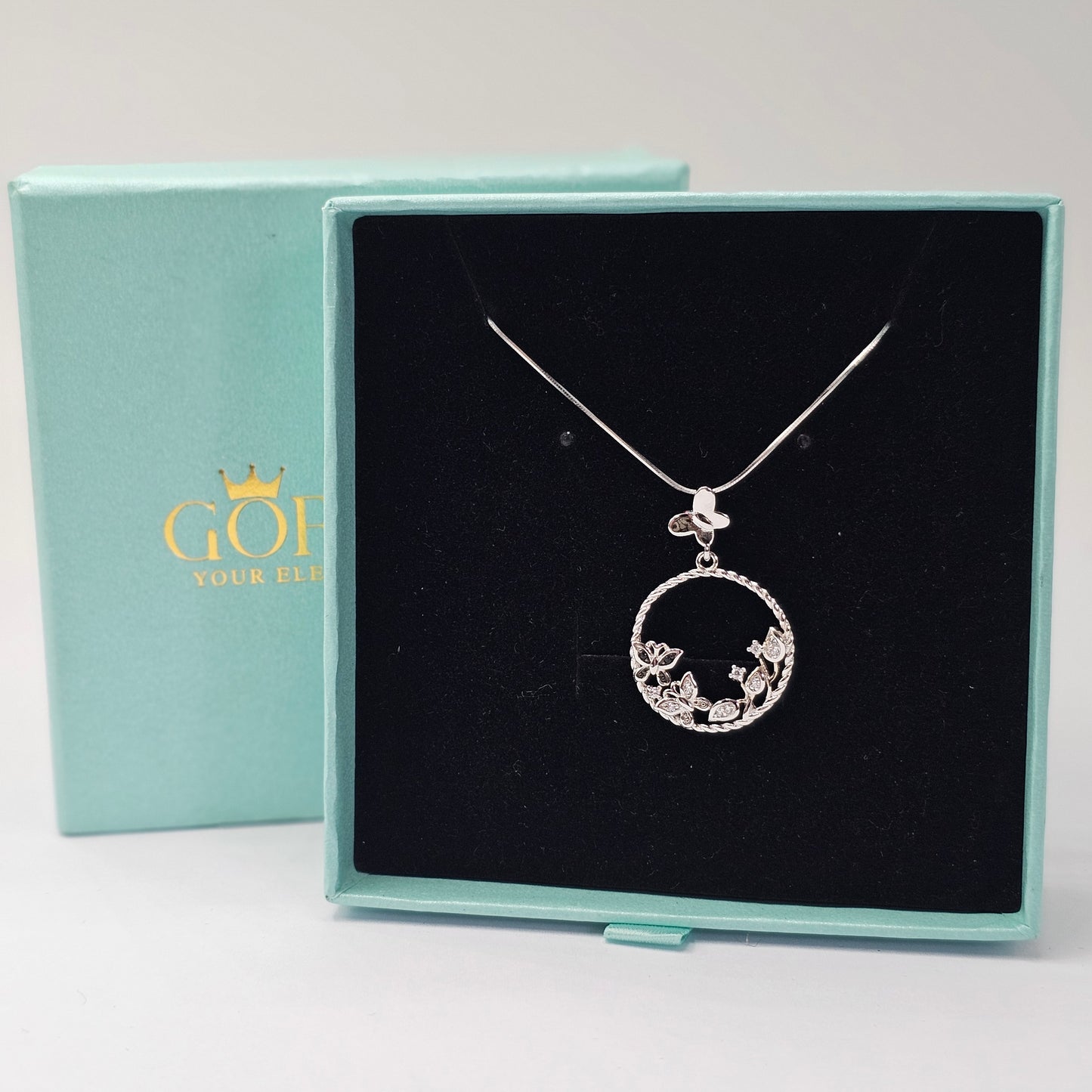 Silver stainless steel butterfly pendant necklace with gemstone accents in elegant box, unisex fashion jewelry.
