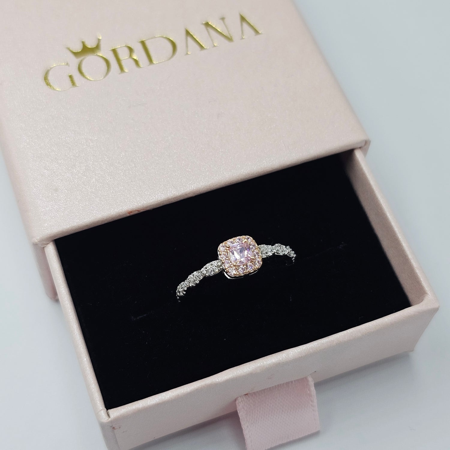 Silver and rose gold stainless steel ring with a sparkling gemstone, elegant unisex fashion jewelry in Mauritius Europe USA.