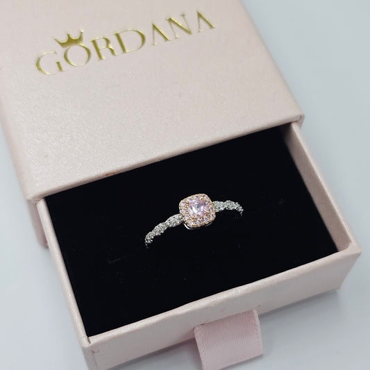 Silver and rose gold stainless steel ring with a sparkling gemstone, elegant unisex fashion jewelry in Mauritius Europe USA.