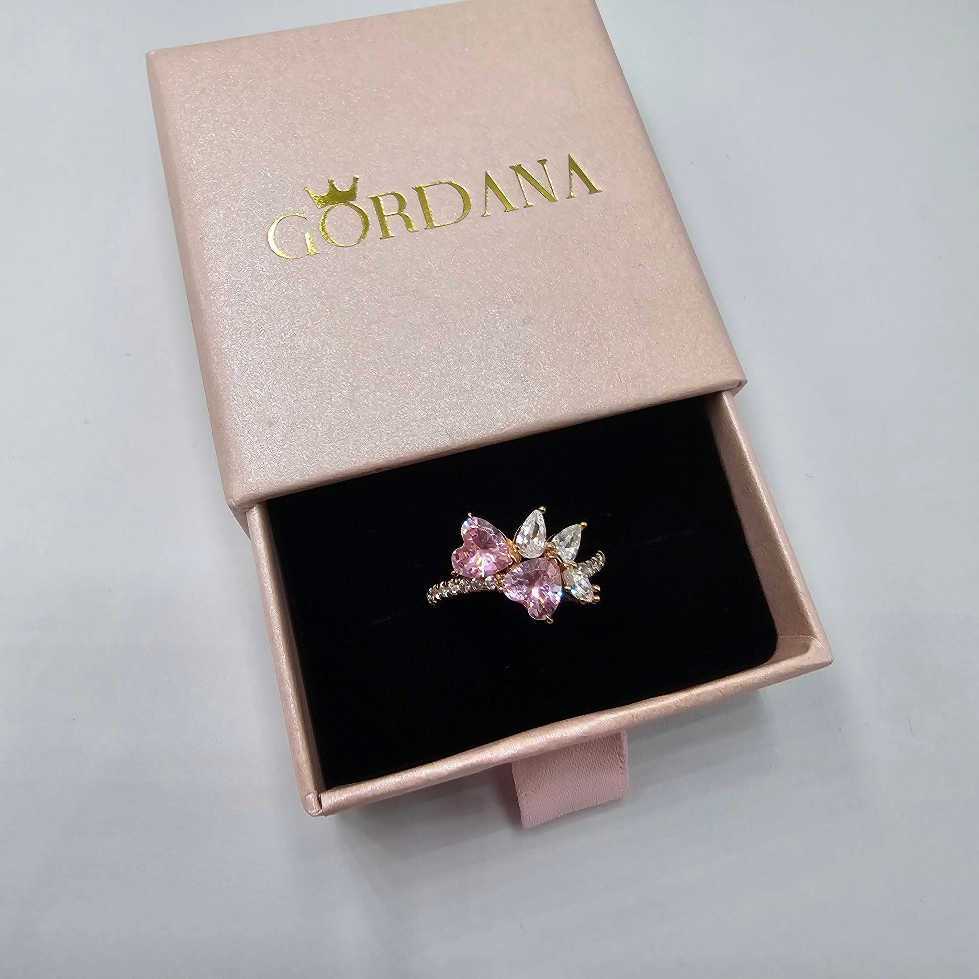 Rose gold stainless steel ring with pink and clear gemstones, elegant unisex fashion jewelry in Mauritius Europe USA style.