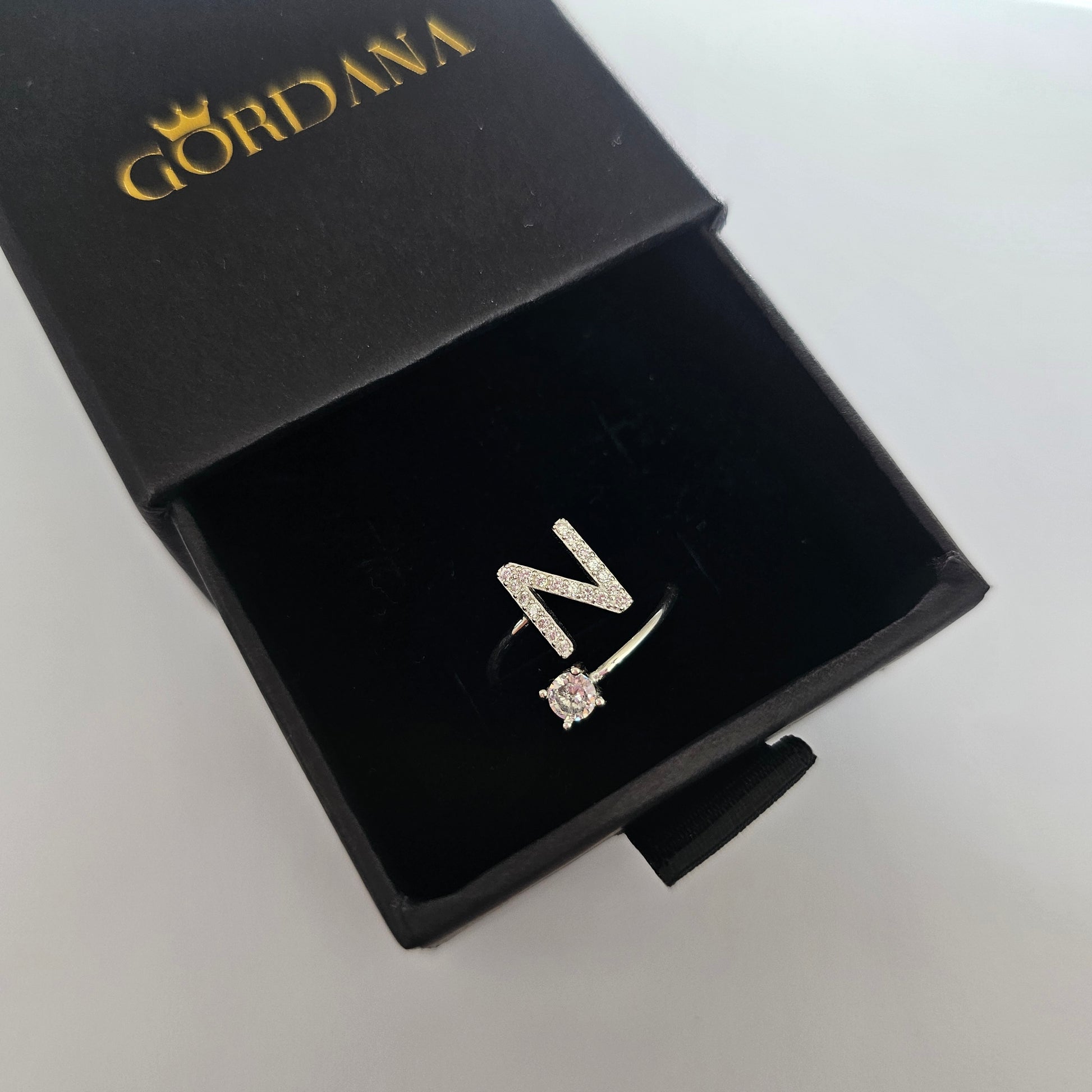 Silver stainless steel alphabet ring N with gemstone, elegant silver jewelry in black box, unisex fashion jewelry.