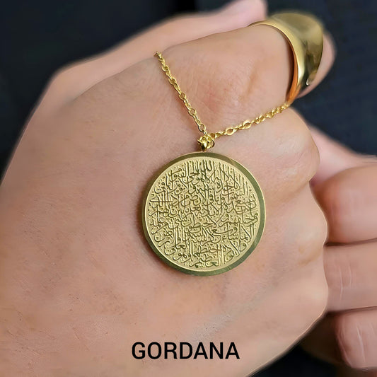 Gold necklace with a round pendant on a hand, featuring the brand 'Gordana'. Ayat ul Kursi stainless steel Necklace