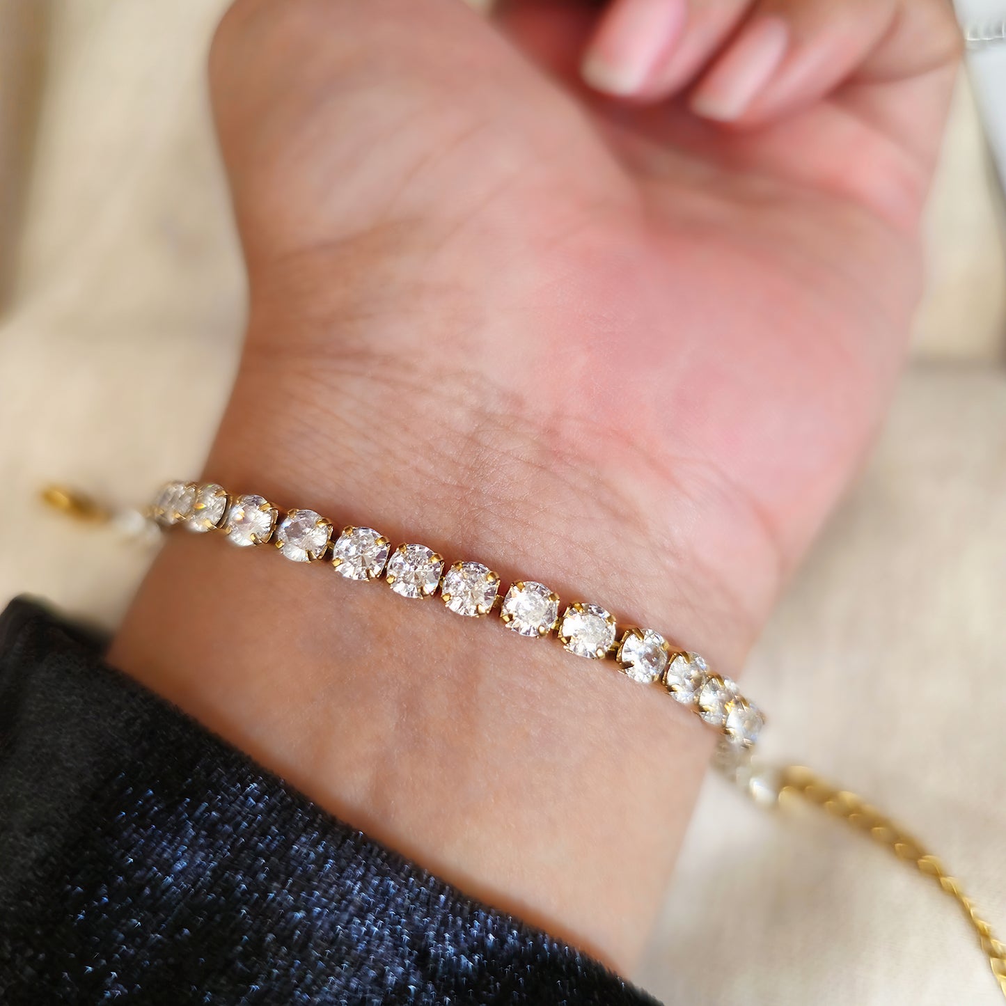 A classic luxury Gold plated stainless steel tennis bracelet with diamonds on a wrist. Gordana jewelry Mauritius. 