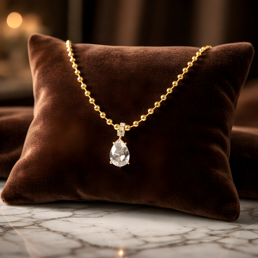 Luxurious gold teardrop pendant with diamond on beaded necklace in premium stainless steel with PVD gold plating for women. 
