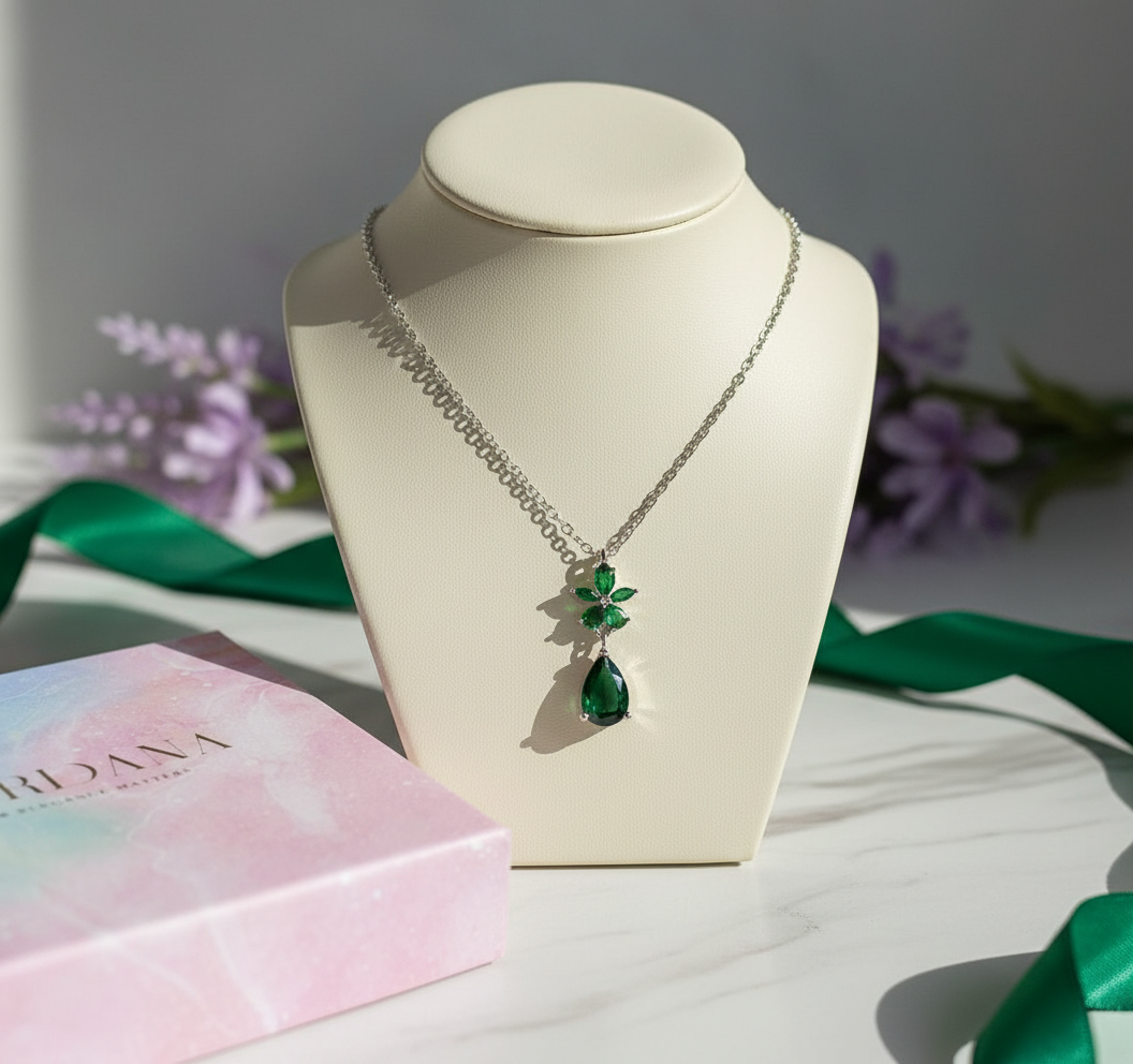 Necklace with a green pendant on a beige bust with a soft background - Green Flower Necklace Mauritius