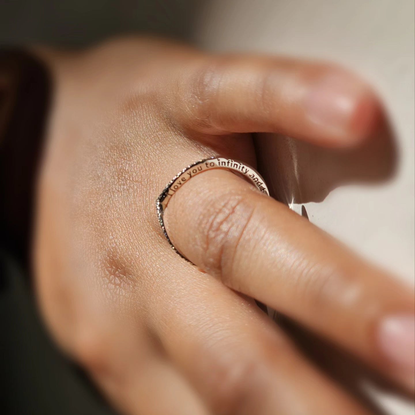 Elegant silver stainless steel ring with delicate engraved infinity and star design, unisex fashion jewelry.