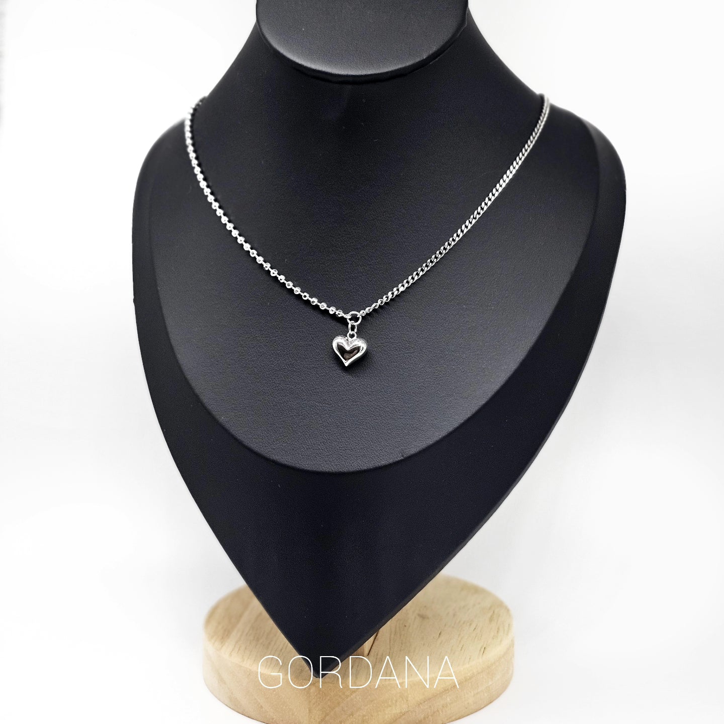 Elegant silver necklace with heart-shaped pendant, stainless steel jewelry, unisex fashion jewelry inspired by Mauritius.