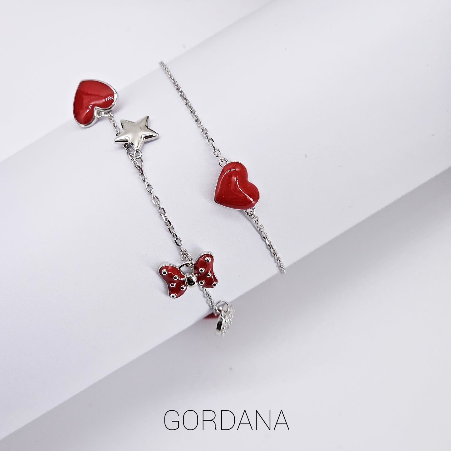 Silver jewelry set with red heart, star, and butterfly charms in stainless steel, unisex fashion jewelry with gemstone.