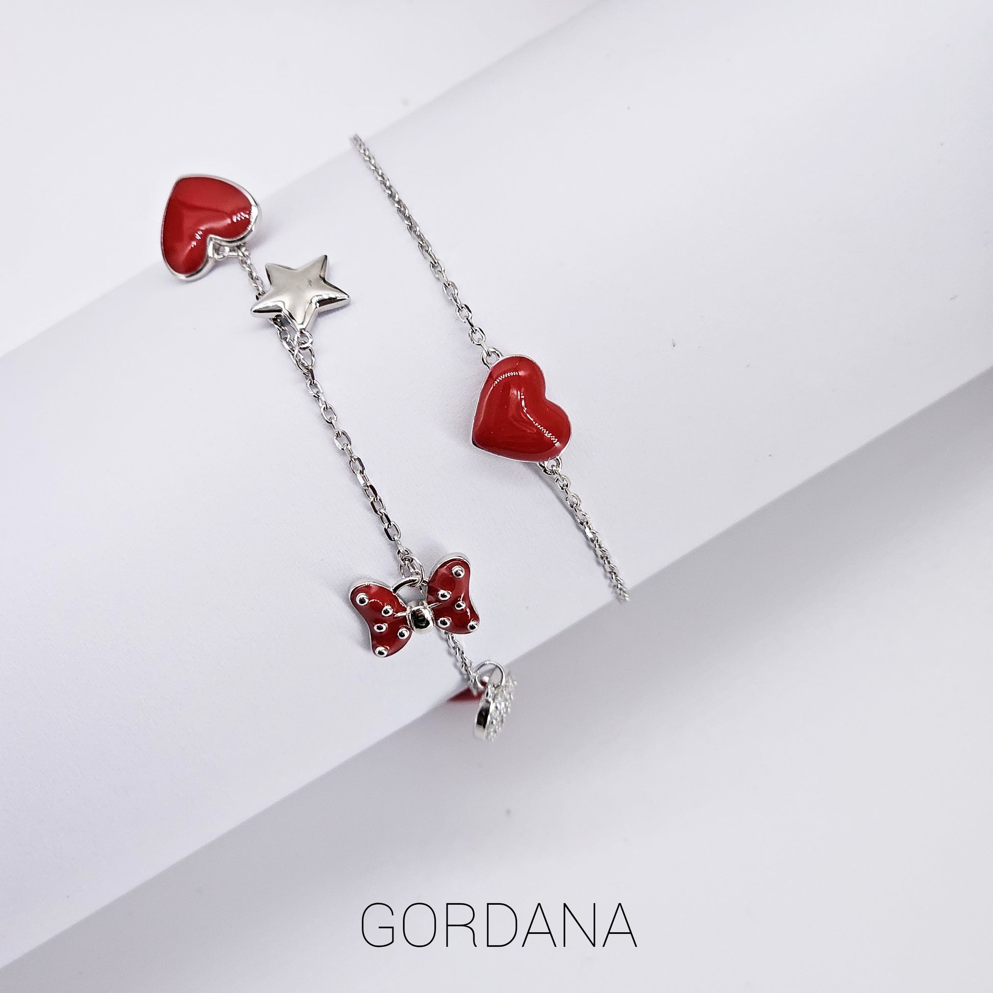 Silver jewelry set with red heart, star, and butterfly charms in stainless steel, unisex fashion jewelry with gemstone.