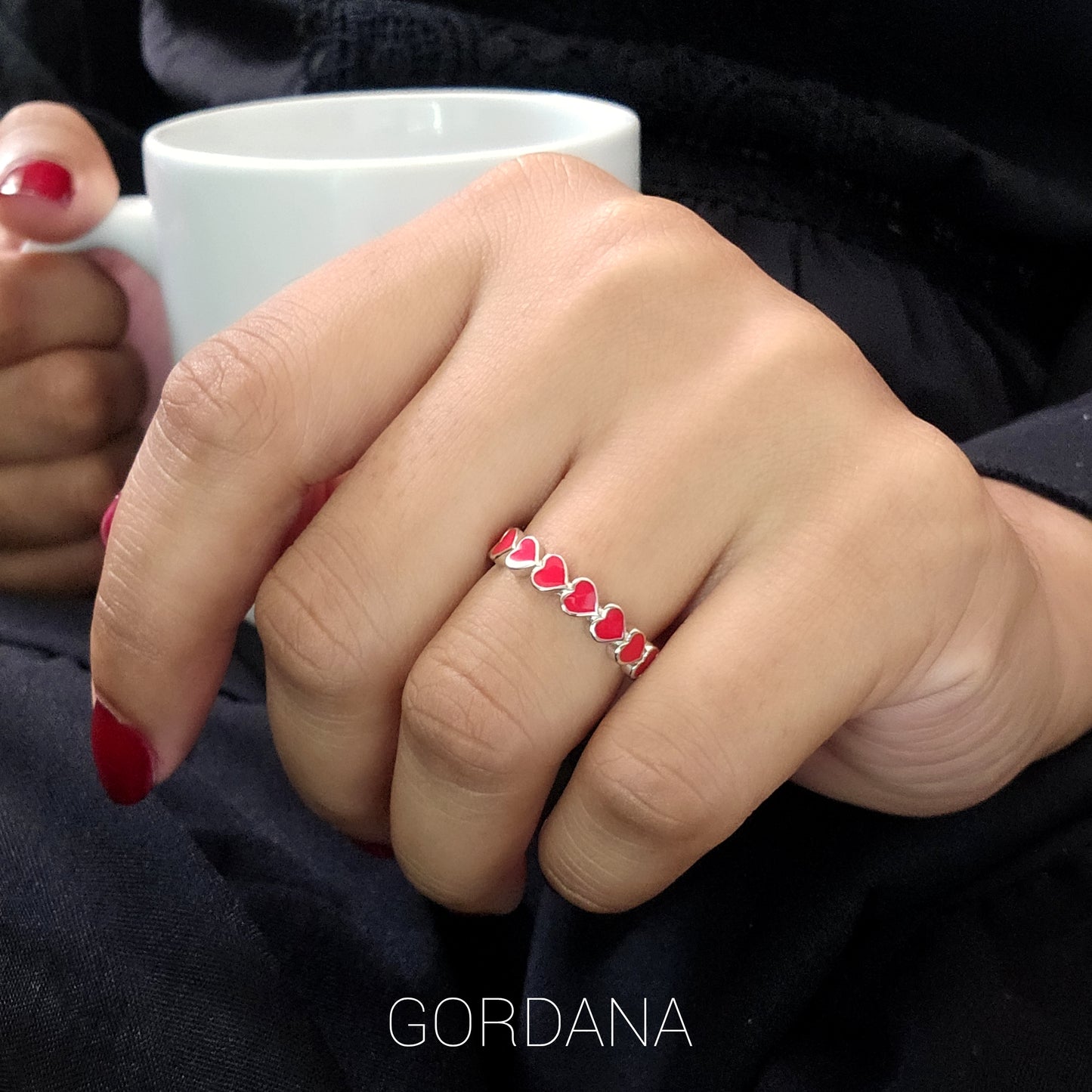 Silver jewelry ring with red heart-shaped gemstones, stainless steel fashion jewelry, unisex style from Mauritius Europe USA.