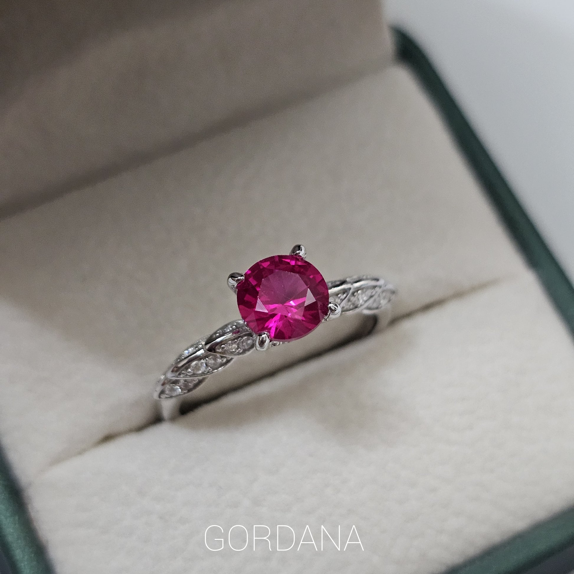 Silver jewelry ring with a vibrant red gemstone, stainless steel band, elegant fashion jewelry for unisex style, Mauritius.