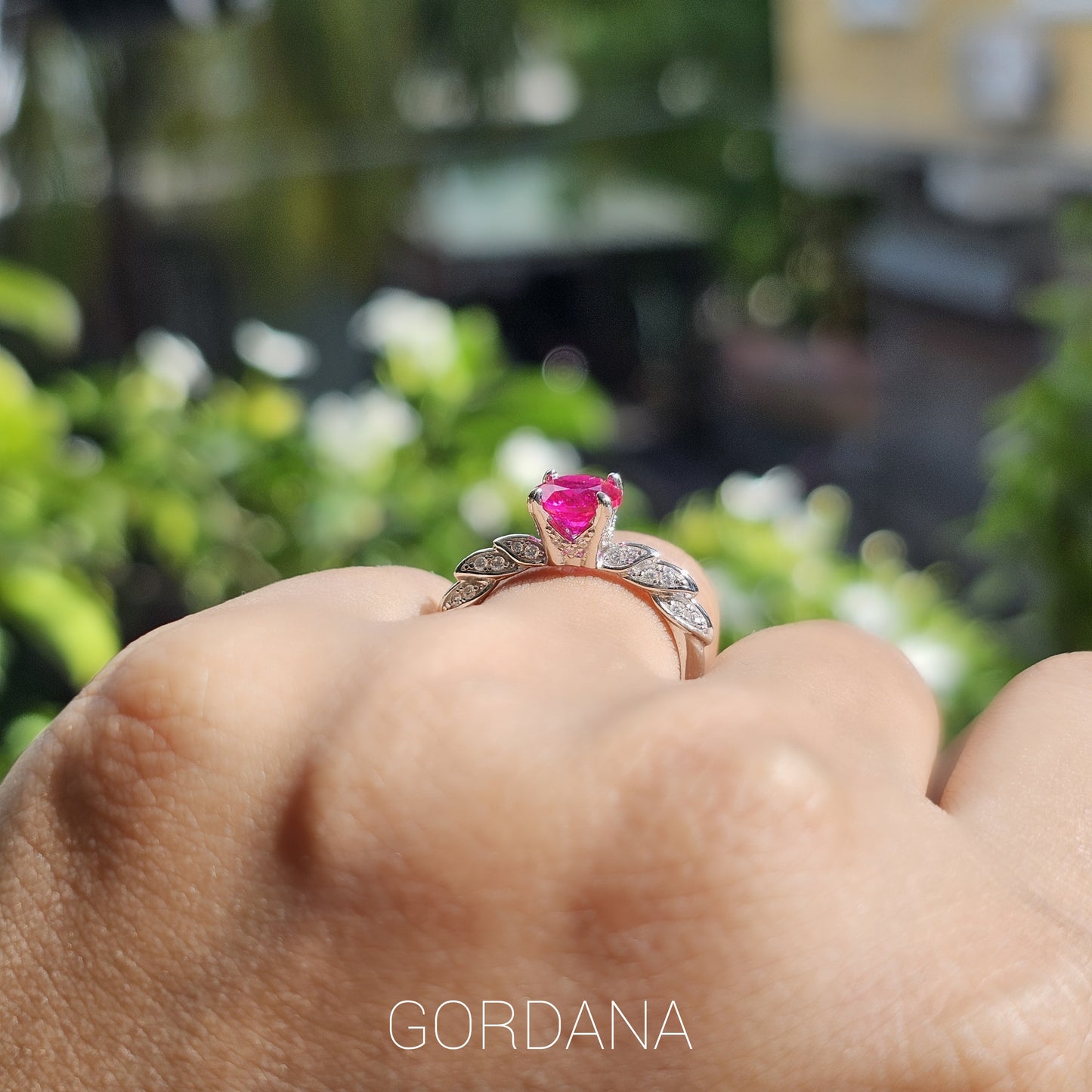 Silver jewelry ring with a vibrant pink gemstone, elegant stainless steel fashion design, unisex style from Mauritius Europe .