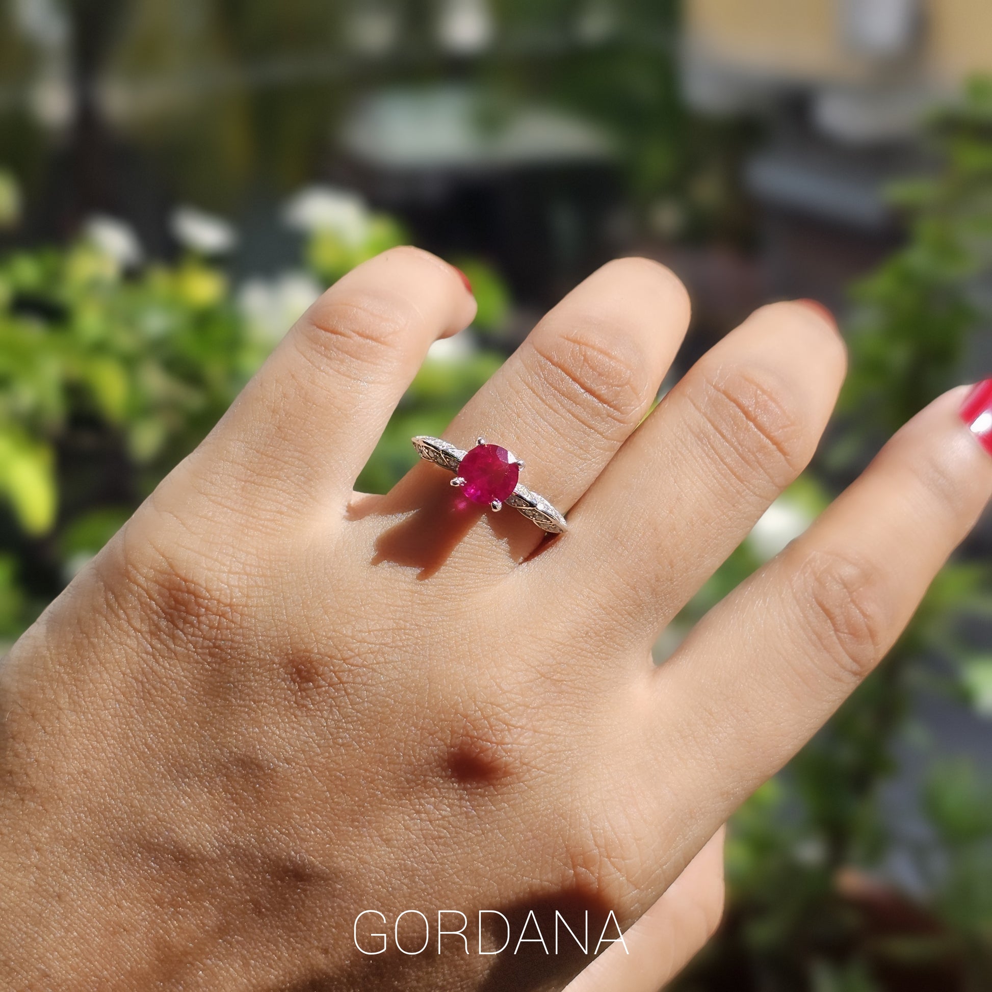 Silver jewelry ring featuring a red gemstone set in stainless steel, unisex fashion jewelry suited for Mauritius, Europe,.