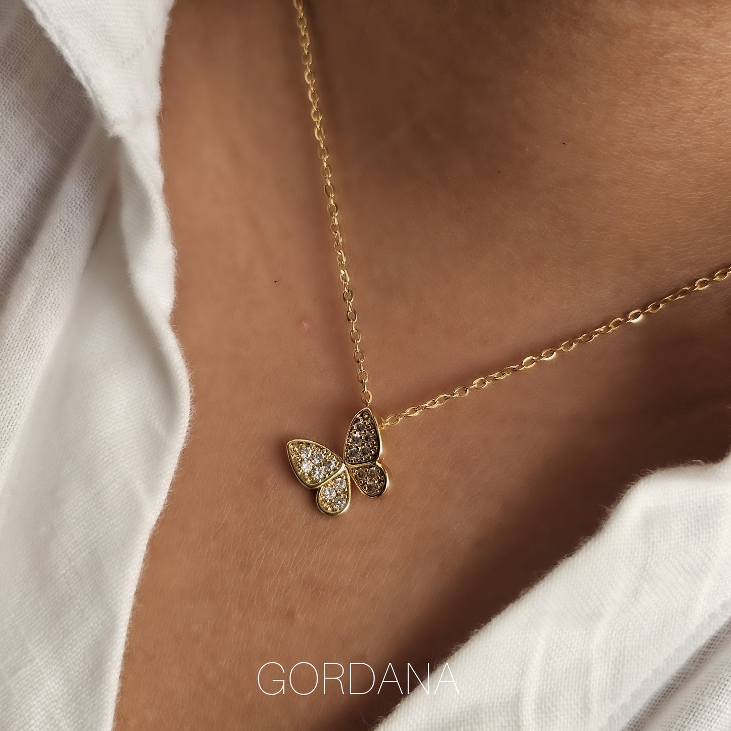 18k gold plated stainless steel butterfly necklace with gemstone accents, stylish unisex jewelry.