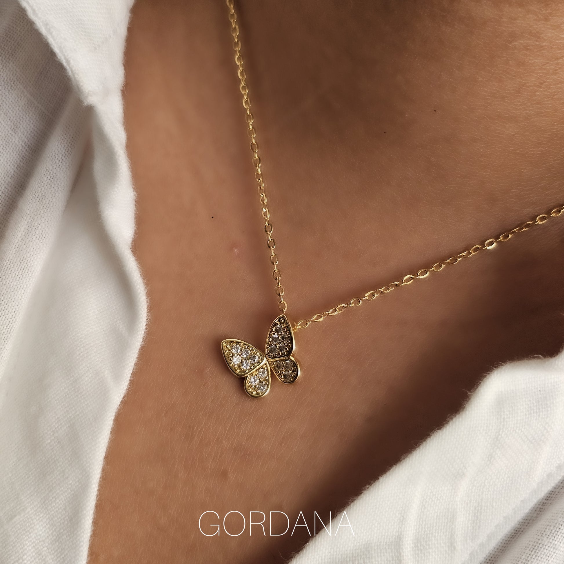 18k gold plated stainless steel butterfly necklace with gemstone accents, stylish unisex jewelry.