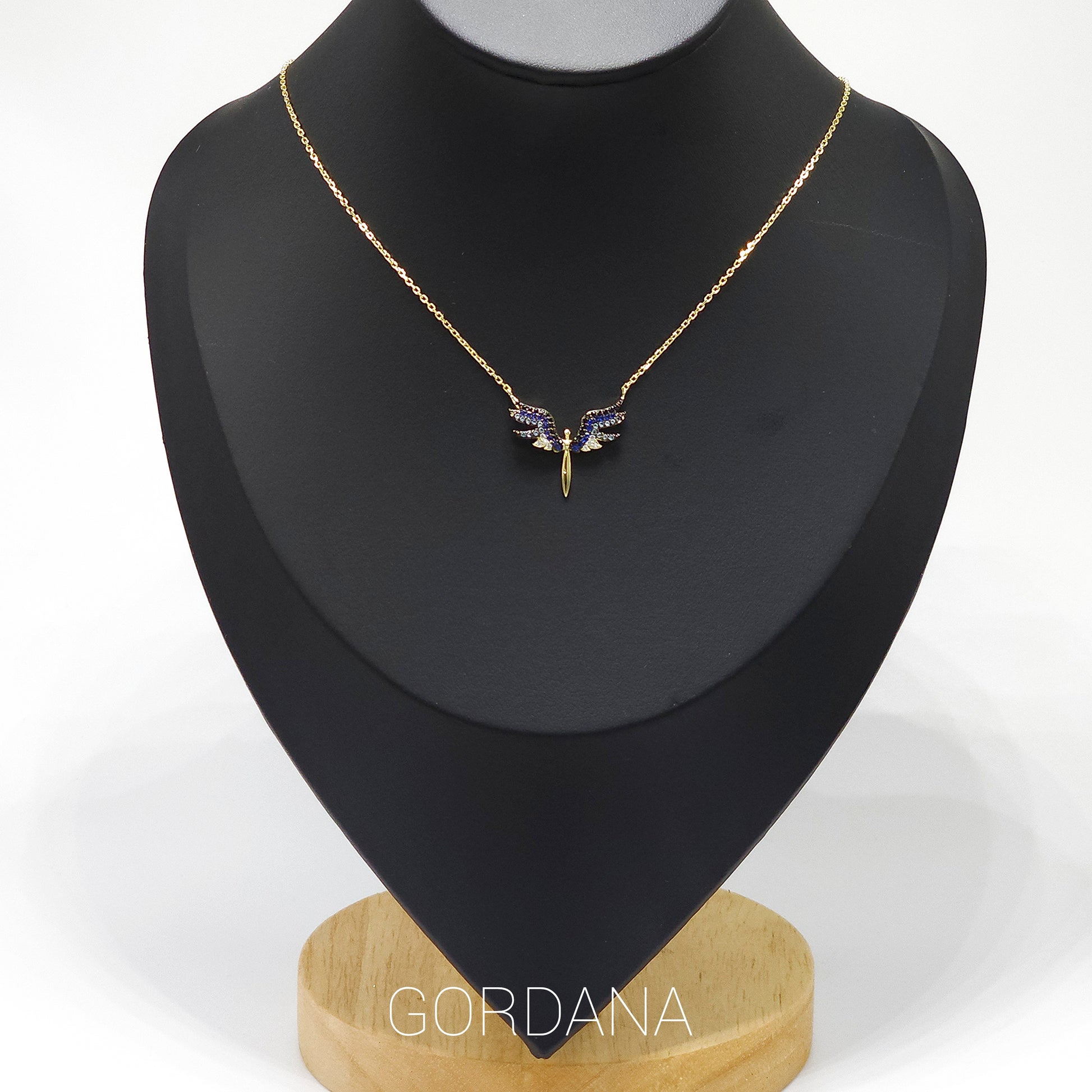 Gold angel wings pendant with purple gemstones on delicate silver chain, unisex stainless steel jewelry, Mauritius Europe.