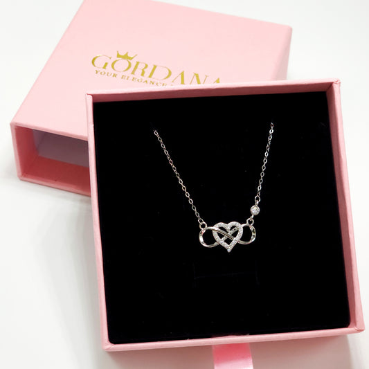 Elegant silver infinity love necklace with embedded gemstones, stainless steel jewelry in a stylish unisex design, perfect.