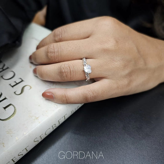 Silver promise ring with solitaire gemstone on hand, stainless steel fashion jewelry, unisex style from Mauritius, Europe,.