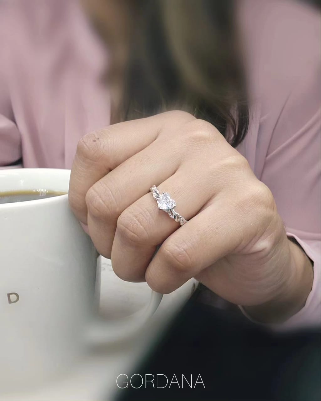 Silver stainless steel promise ring with a central marquise-cut clear gemstone and a sleek band design.