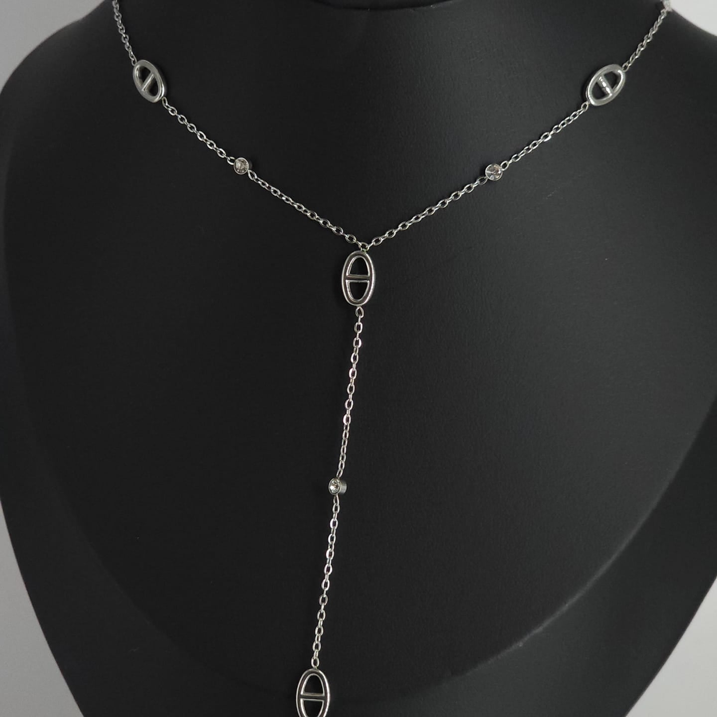Delicate silver stainless steel necklace with oval links and a dangling chain detail.
