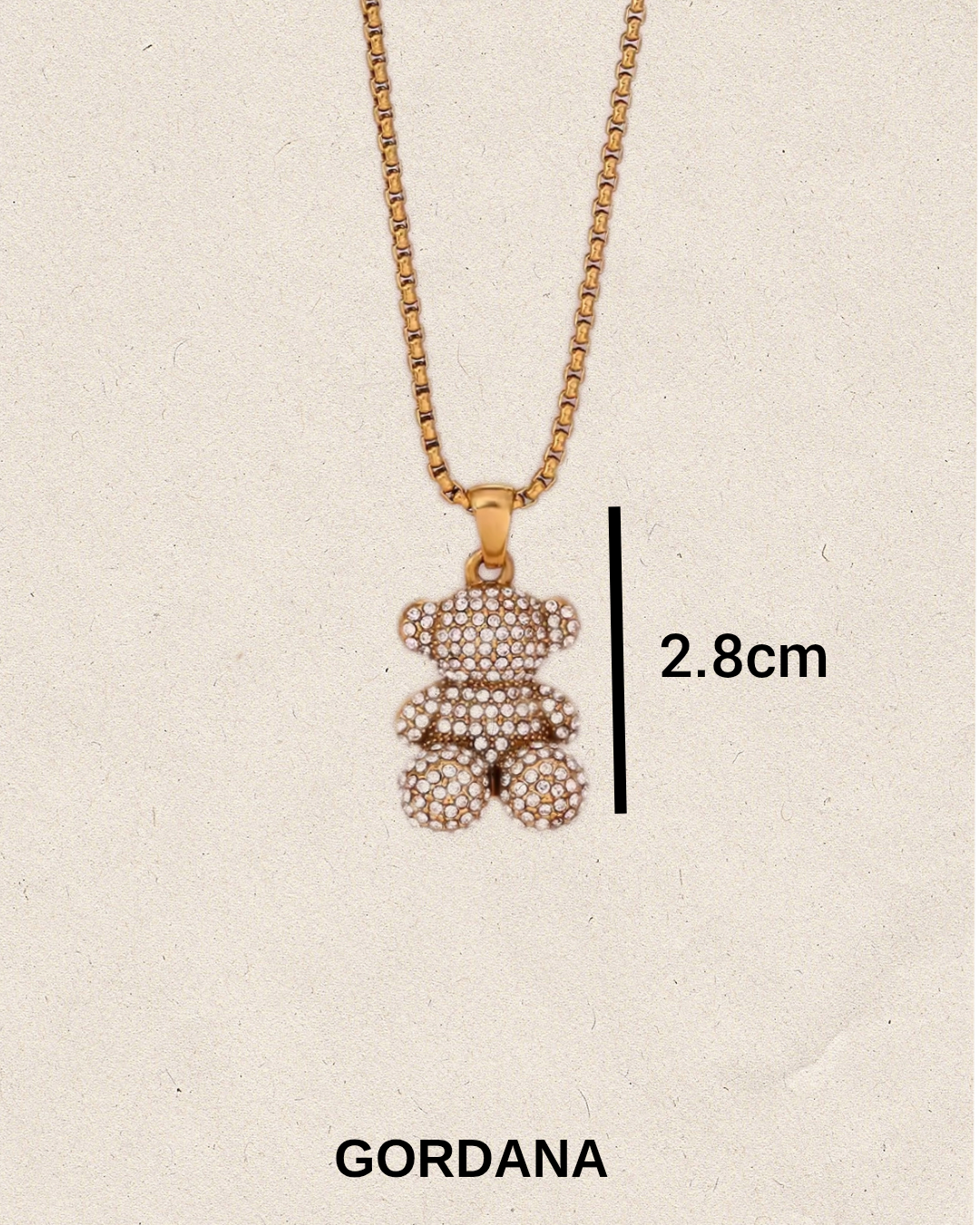 Gold plated stainless steel teddy bear pendant necklace with measurement on a beige background for women