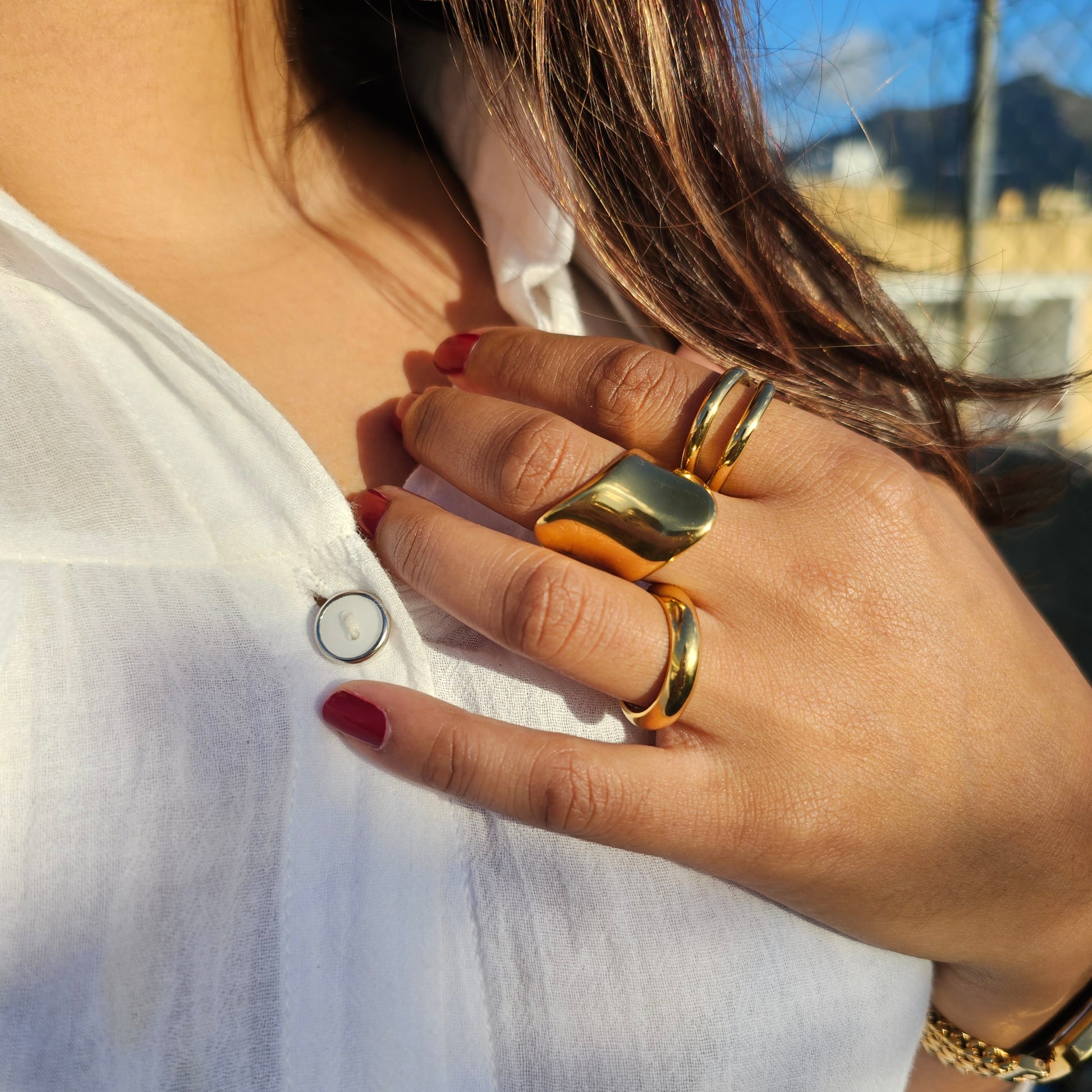 Elegant stainless steel jewelry set featuring silver and 18K gold-plated rings with smooth and textured designs, perfect.