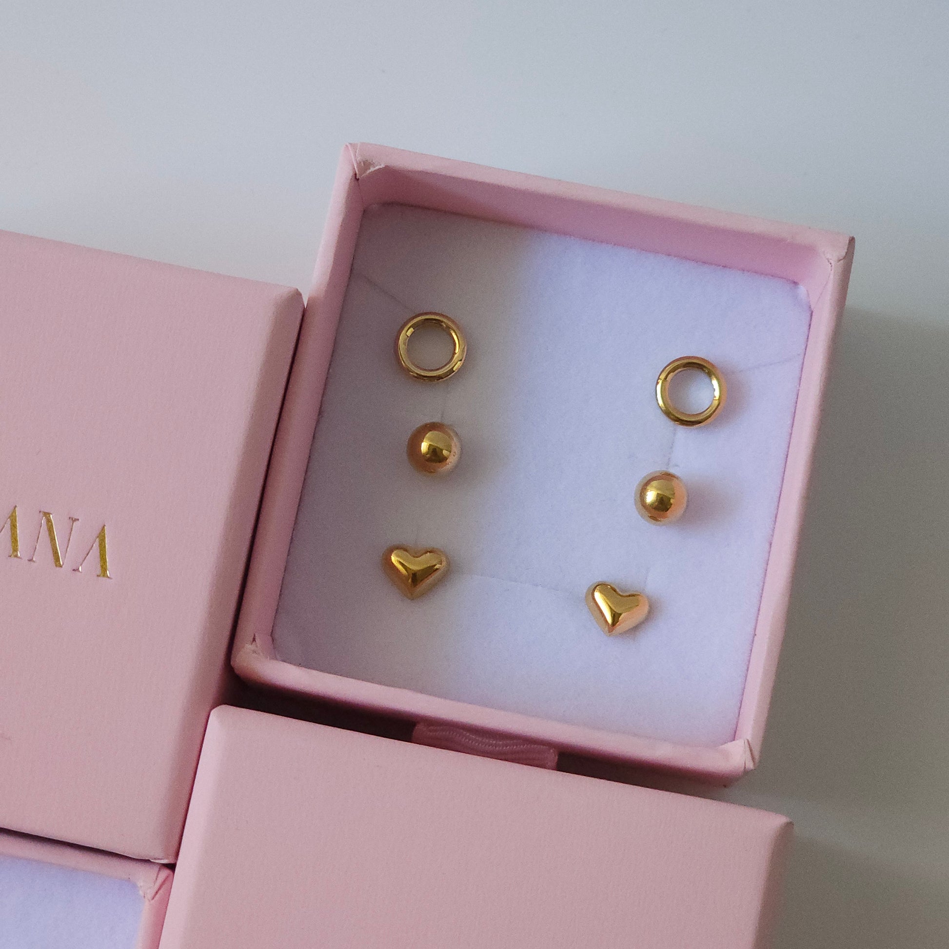 18K gold plated stainless steel earrings trio set with hoops, balls, and hearts, unisex stylish fashion jewelry.