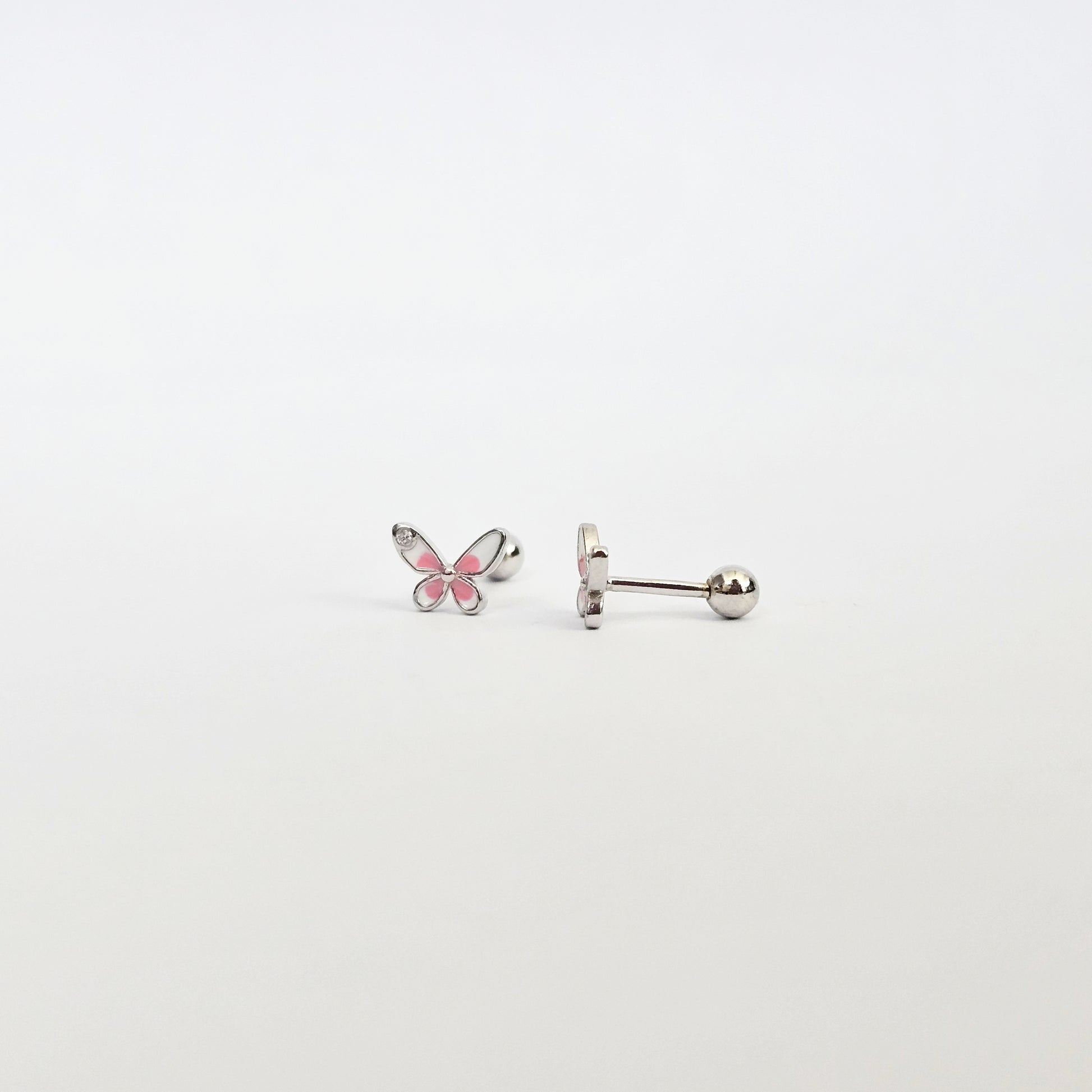 Silver butterfly stud earrings with pink gemstone accents, stainless steel fashion jewelry, unisex style.