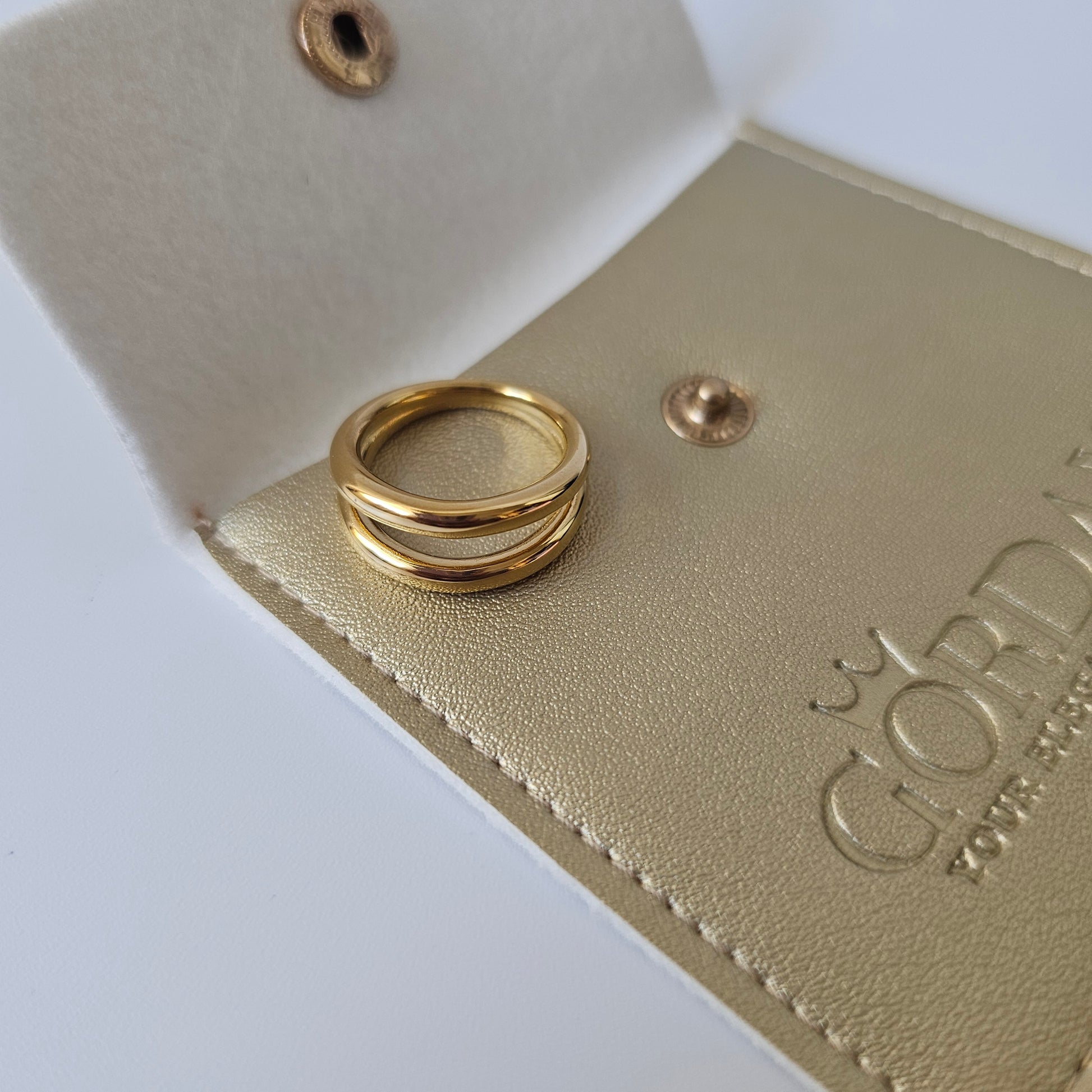 Elegant 18K gold plated stainless steel ring with layered design, unisex fashion jewelry style.