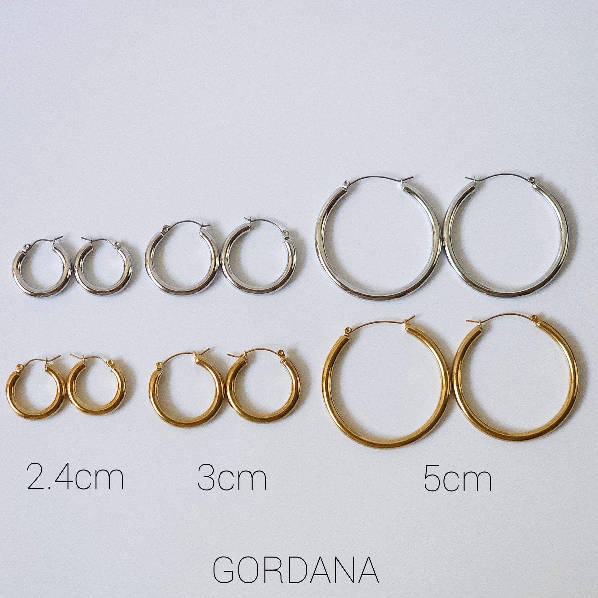 Set of stainless steel jewelry with silver and gold 2.4cm, 3cm, and 5cm hoop earrings, elegant unisex fashion jewelry,.