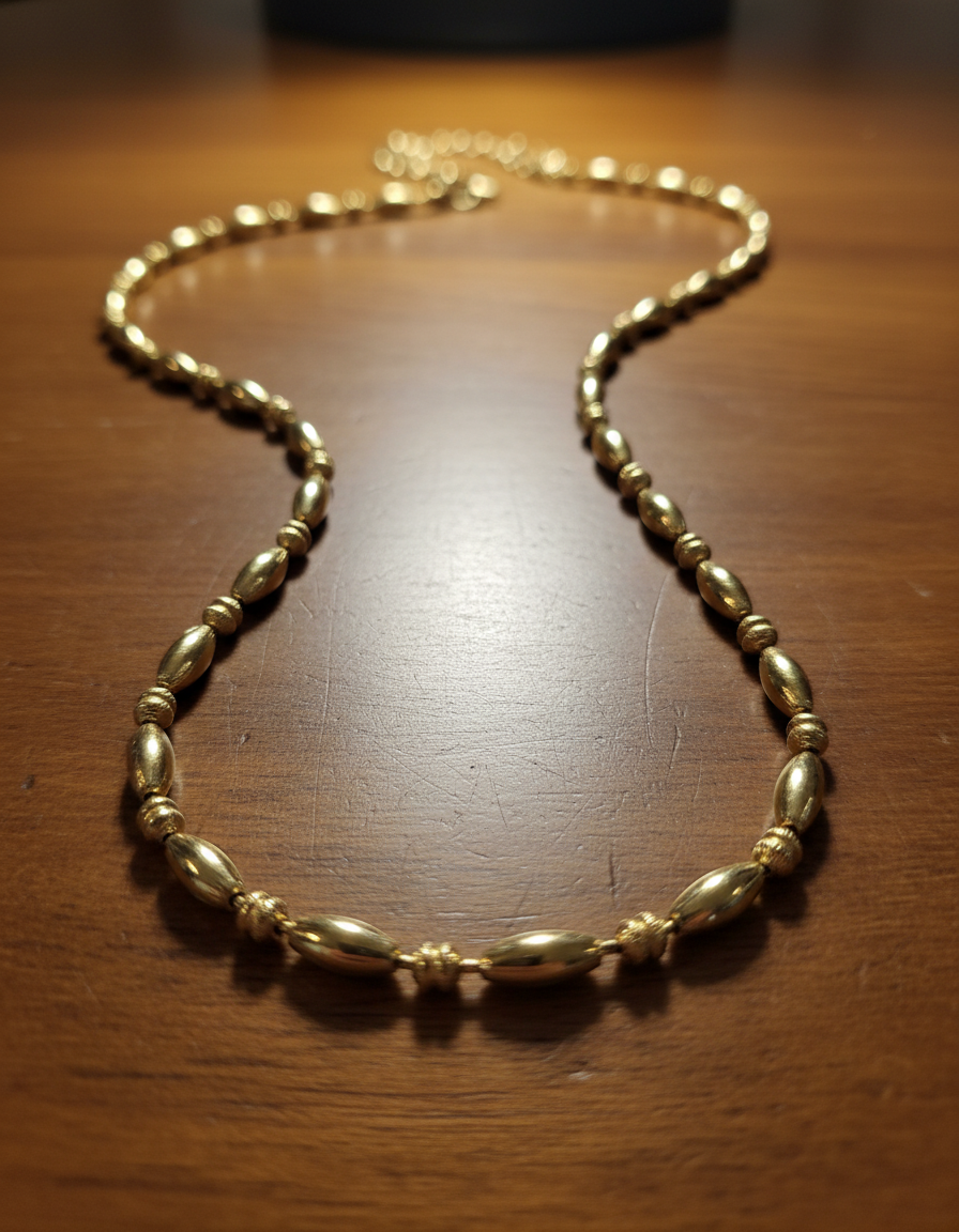 Dainty and minimalist Gold necklace on a wooden surface